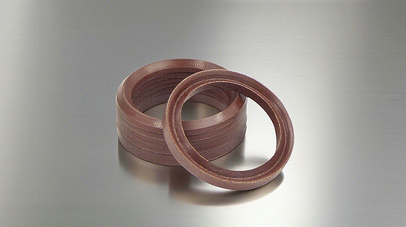 氟橡膠V型夾布油封---是由氟橡膠（FKM）+夾布密封材料制成的油封，主要應用于盾構機、冶金設備、陶瓷設備、重載油缸、油壓機等